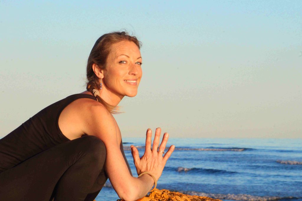 Malasana Yoga Pose by the sea, Estepona. Nirmala Yoga by Fox No Limits